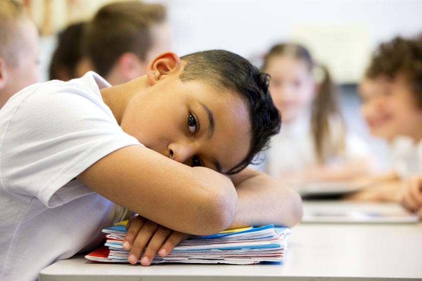 A student looks upset and stressed at school