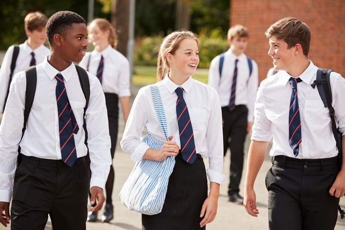 students chatting outside school