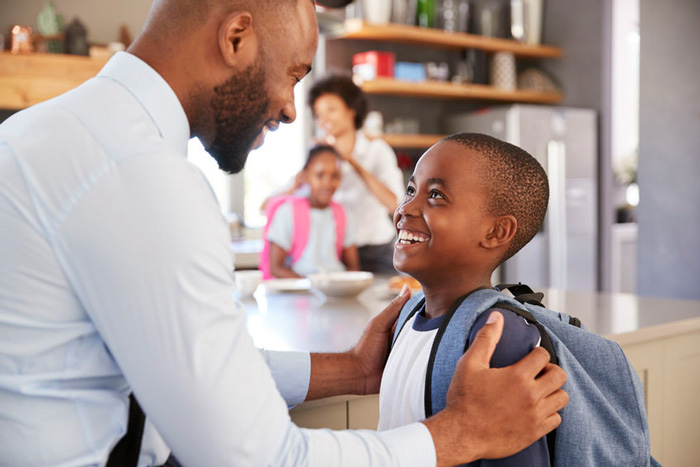 parent giving pupil praise