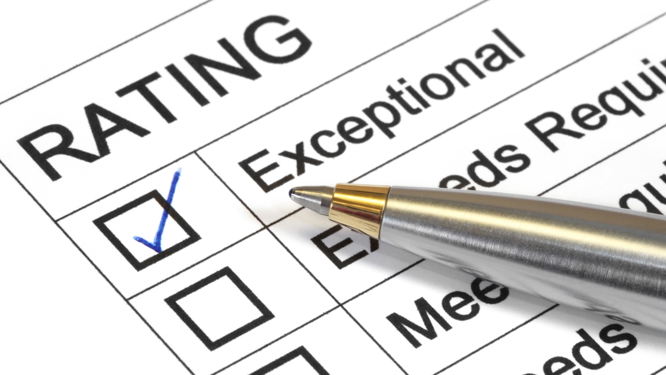 a checlist and pen displaying ratings